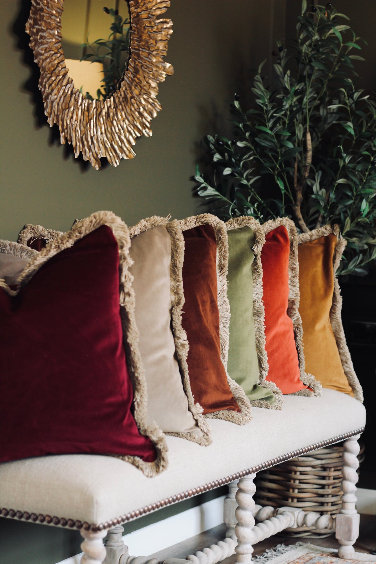 Langford Whiskey fringed velvet cushion in a warm whiskey tone, 55 x 55cm
