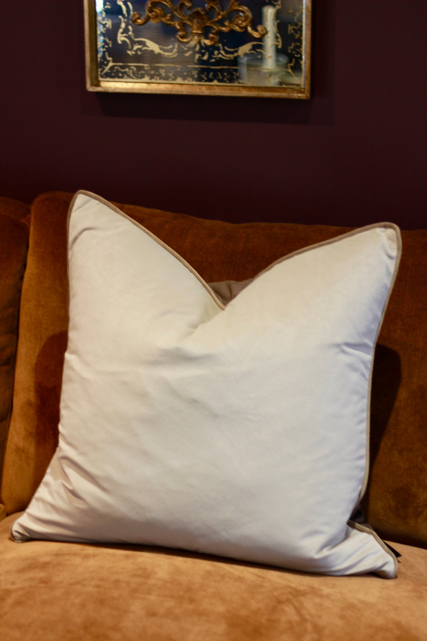 Side view of reversible brown and taupe cushion