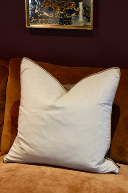 Side view of reversible brown and taupe cushion