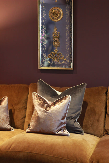 Soft velvet texture on brown and taupe cushion