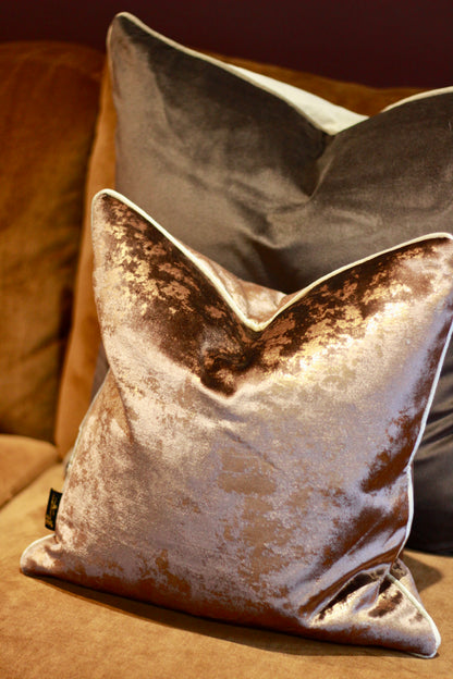 Chocolate cushion showing its bronze-toned metallic sheen in the light.