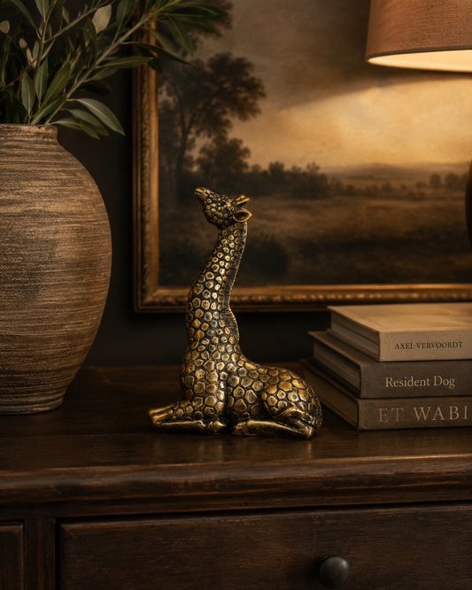 Gold giraffe decoration styled as a statement accent in an elegant interior.