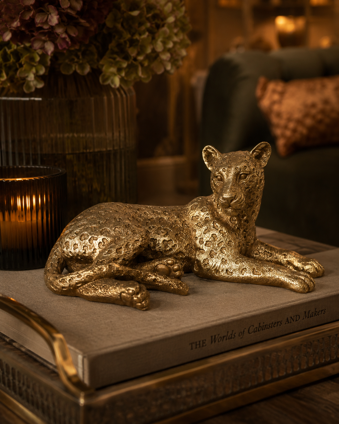 Gold laying leopard decoration styled as statement tabletop decor.