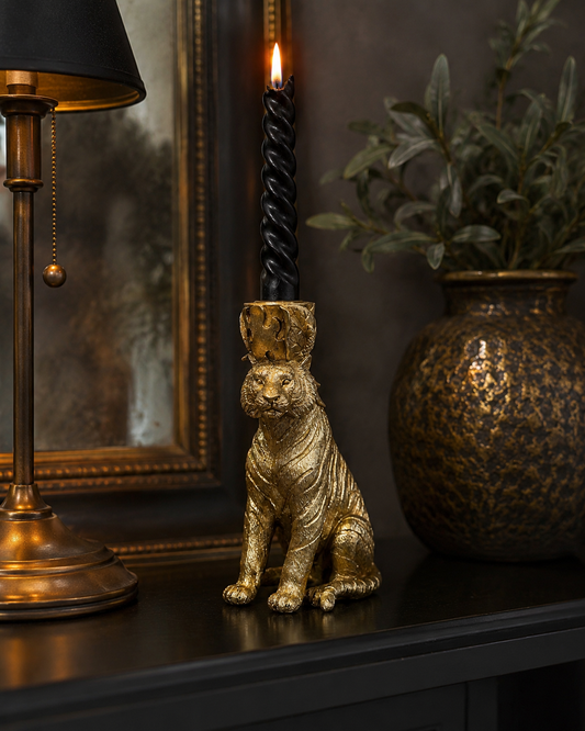 Gold tiger candle holder shown from the front with detailed sculpted features.