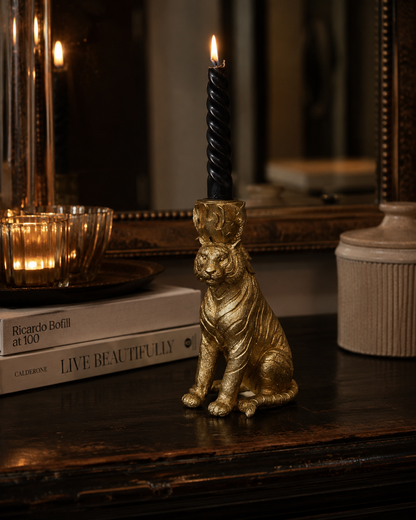 Side view of the decorative gold tiger candle holder.