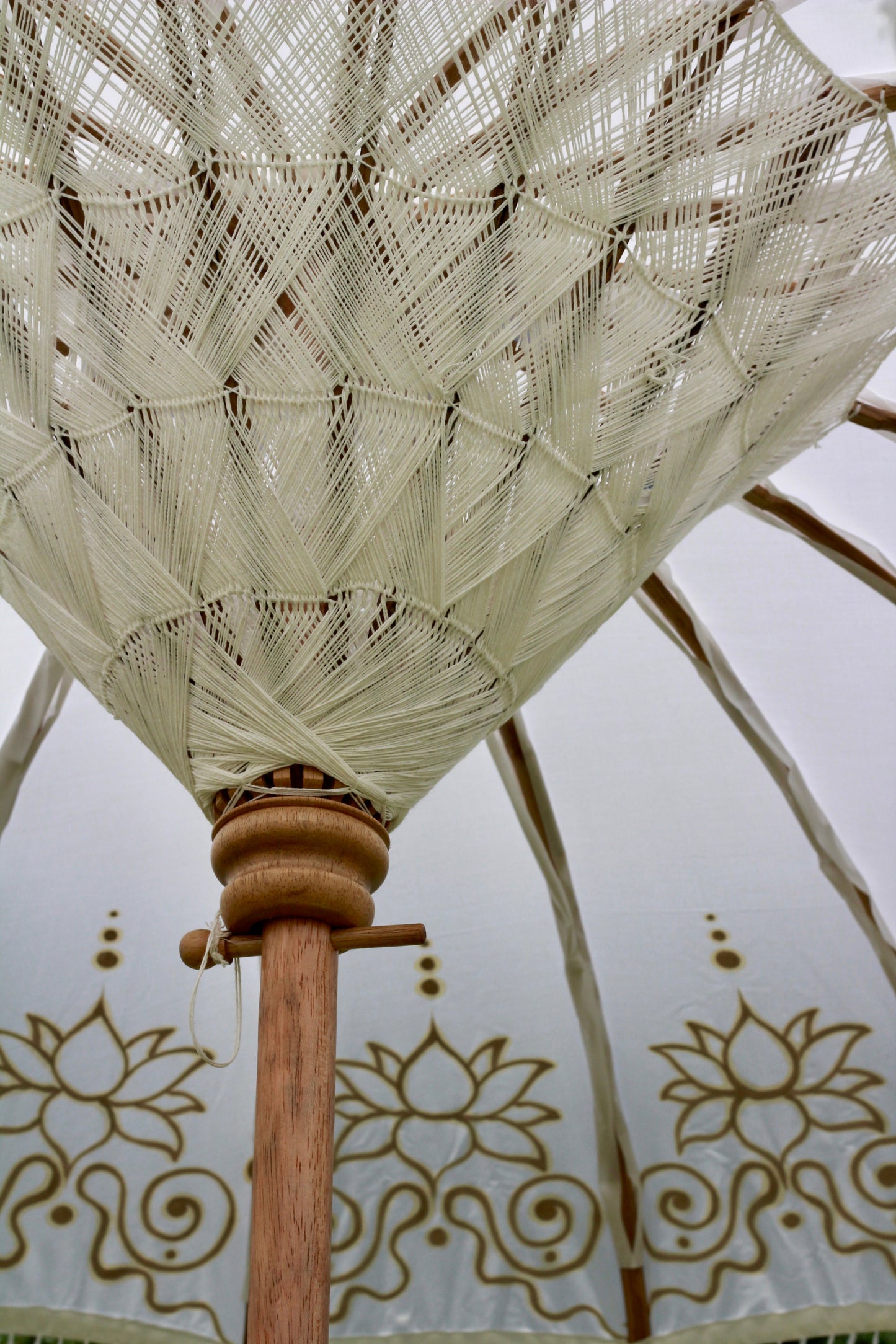 Gold and white decorative garden parasol styled for an elegant English garden setting