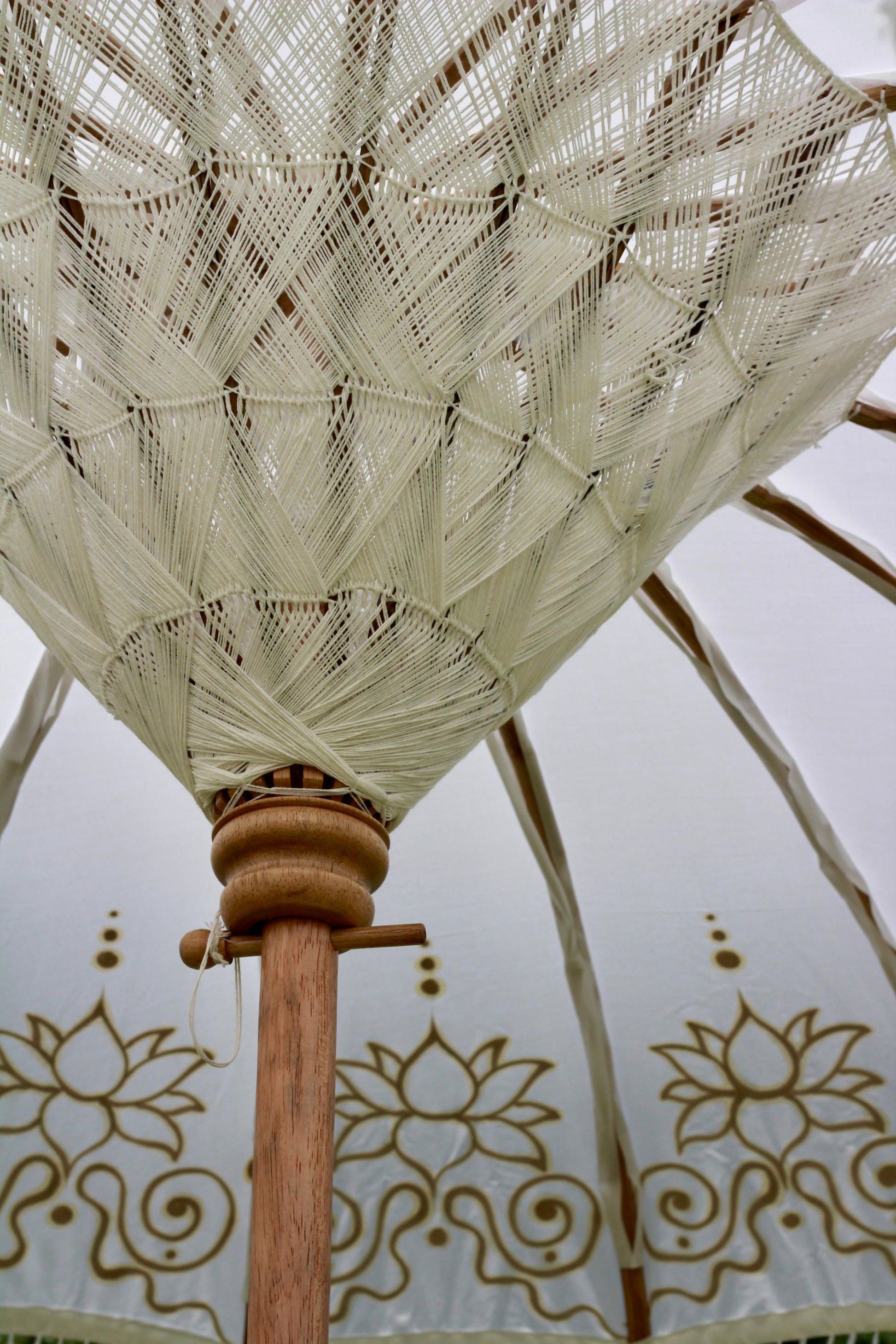 Gold and white decorative garden parasol styled for an elegant English garden setting