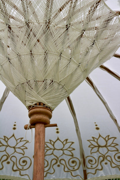 Gold and white decorative garden parasol styled for an elegant English garden setting