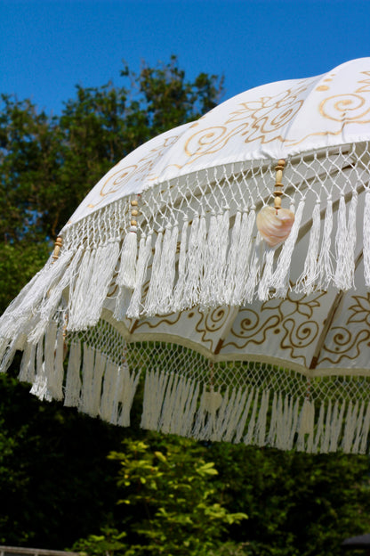 Gold and white mother of pearl style garden parasol for elegant outdoor decor