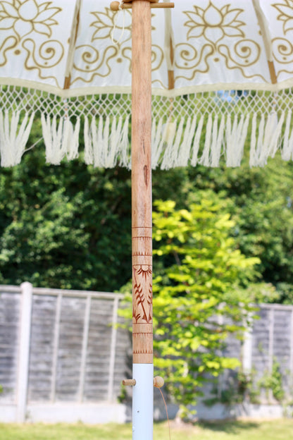 Hand painted gold and white Balinese-style garden parasol with decorative floral design