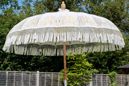 Luxury gold and white garden parasol with decorative canopy for patio styling