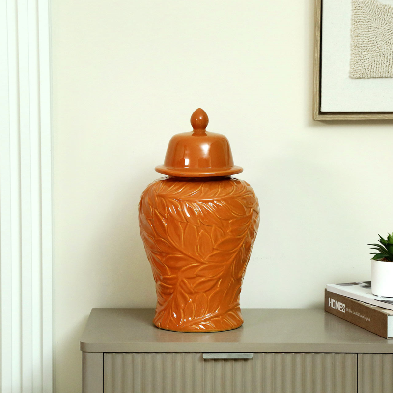 Orange ginger jar, ceramic decorative jar, embossed leaf jar, bold home décor, orange vase with lid, colourful interior accessories, statement ceramic jar