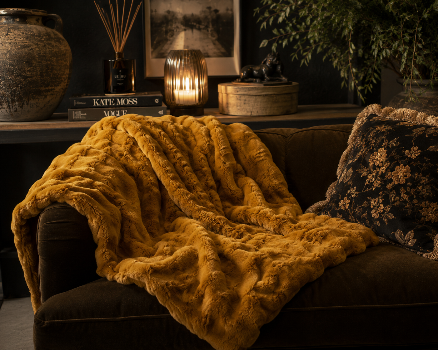 Whiskey brown faux fur ruffle throw styled in a warm neutral living room.