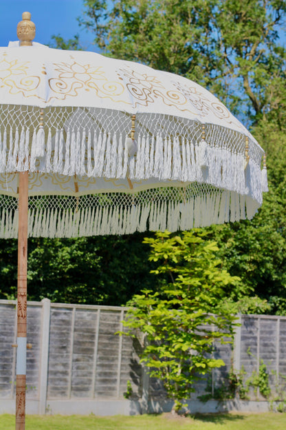 White and gold fringed parasol for summer garden styling and outdoor living