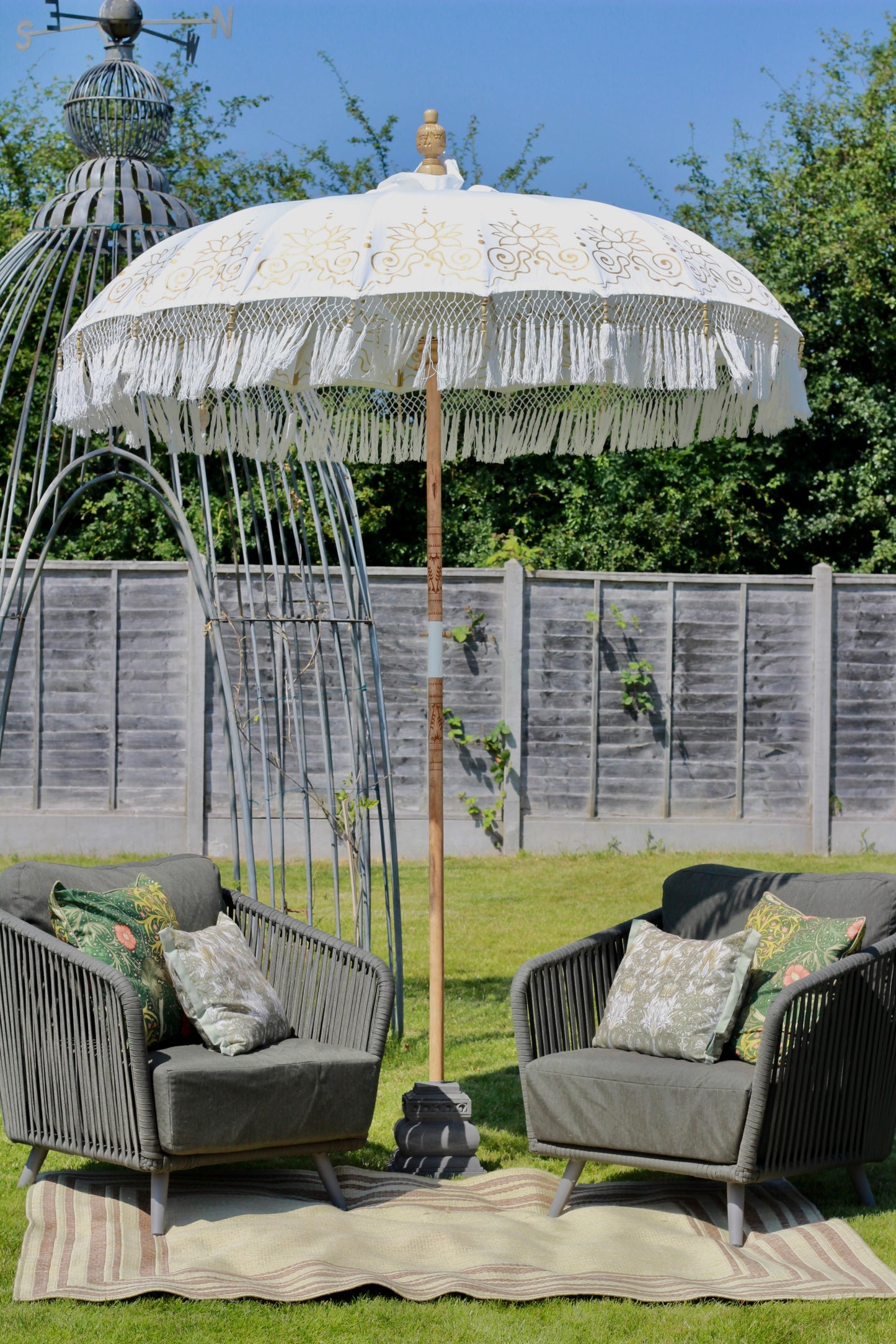 White and gold garden parasol for patio, terrace and summer garden styling